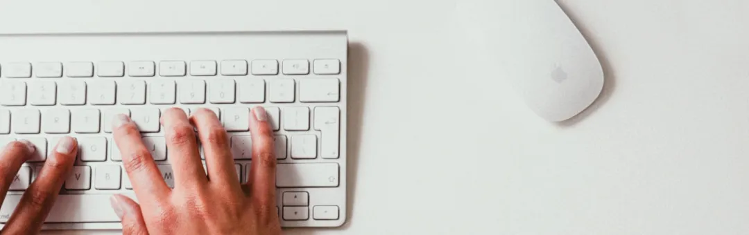 Human being typing on a keyboard for help